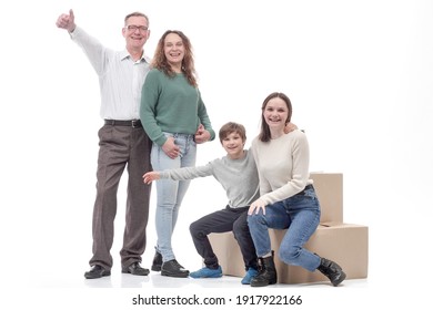 in full growth. happy family with cardboard boxes.