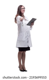 in full growth. young doctor making notes in the clipboard