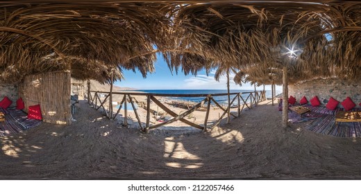 full hdri seamless spherical 360 panorama thatched hut with daybeds and cushions for relaxing or palm tree hut on Red Sea coast in equirectangular projection ready for virtual reality VR AR 