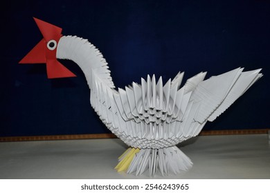 Full indoor shot of a meticulously crafted origami chicken. 

 - Powered by Shutterstock