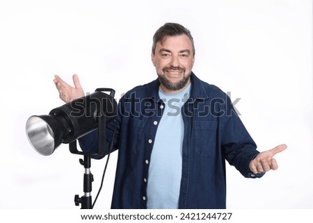 Full isolated studio picture from a photographer with a studio flash unit
