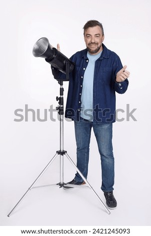Full isolated studio picture from a photographer with a studio flash unit