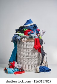 Full Laundry White Wicker Basket On The Grey Background