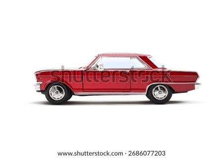 Full left side view of a red colored muscle model toy car photographed on a white background.