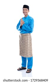 Full Lenght Portrait Of Muslim Smiling With Baju Koko Hari Raya Isolated Over White Background