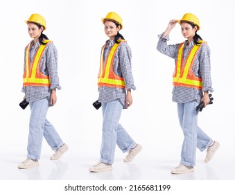 Full Length 20s Young Caucasian Engineer Contractor Woman, Walking Forward Left Right, Wear Safety Vast Hardhat Gloves. Office Female Stands Feels Smile Happy Over White Background Isolated