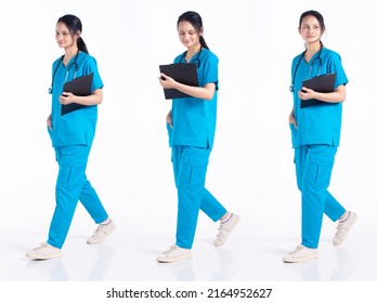 Full Length 20s Young Mix Race Hospital Nurse Woman, Walking Forward Left Right Step, Wear Stethoscope Blue Uniform. Doctor Female Feels Smile Happy Over White Background Isolated