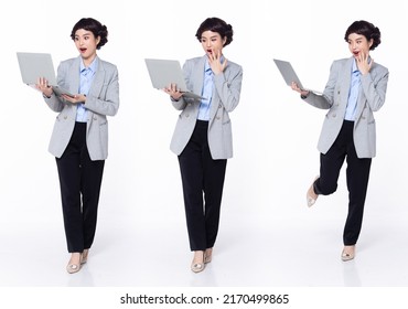 Full length 30s 40s Asian Woman teacher manager business, wow surprise glad shock, wear formal blazer pants shoes. Smile Office female carry laptop coffee cup over white background isolated