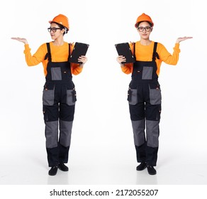 Full length 30s 40s Asian Woman Industry electrician, showing empty palm hand, wear formal jumpsuit safety gear. Smile electric female carry tablet coffee cup over white background isolated