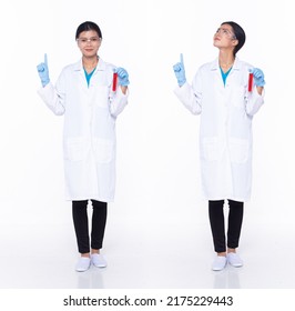 Full Length 30s Asian Woman Scientist Science Doctor, Pointing Finger Up In Air, Wear Uniform Dress. Black Hair Laboratory Female Feel Happy Smile Wellness Over White Background Isolated