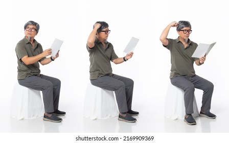 Full Length 50s 60s Asian Chinese Shop Owner Man, Reading Book Newspaper, Wear Formal Casual Dress Sit On Chair. Old Middle Age Male Sitting And Check Calculator Over White Background Isolated