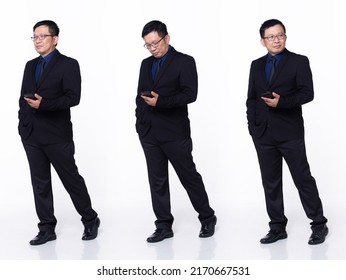 Full Length 60s 50s Asian Senior Man Business Executive Manager, Walking Forward Left Right, Wear Black Formal Suit. Confident Office Male Carry Internet Phone Over White Background Isolated