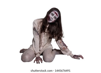 Full length of asian female zombie sitting on the floor isolated over white background