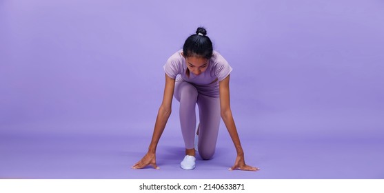 Full Length Of Asian Slim Tanned Skin Fitness Woman Hands Touch Ground Floor Ready To Start To Run To Goal, Purple Background, Concept Woman Can Do Athlete In Very Peri Color Block Mood Tone