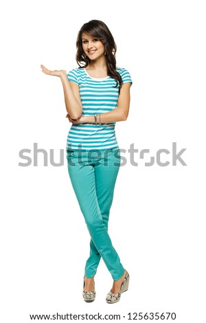 Full length of beautiful  woman showing / holding on the palm blank copy space over white background
