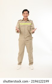 Full Length Body Photo Of An Asian Young Handsome Construction Worker, Holding Blue Print, In Working Uniform, Isolated On White Background