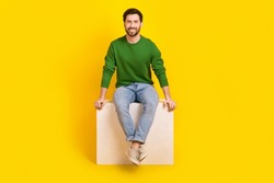 Full Length Body Photo Of Cheerful Young Satisfied Marketolog Businessman Guy Sitting White Box Podium Isolated On Yellow Color Background