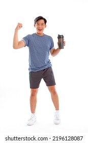 Full Length Body Photo Of A Young Asian Man With Muscular Body Holding A Shake Bottle Tumbler And Drink With One Hand Stand Facing On Isolated Background.