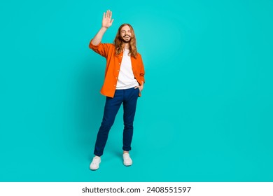 Full length body photo young handsome model blond hair man waving palm greetings to team partners isolated on cyan color background