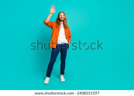 Full length body photo young handsome model blond hair man waving palm greetings to team partners isolated on cyan color background
