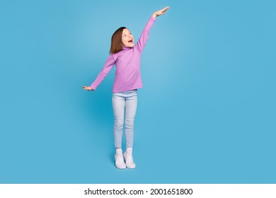 Full Length Body Size Little Girl Smiling Showing Heigh Isolated Pastel Blue Color Background