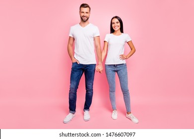 Full Length Body Size Photo Of Glad Funky Couple Standing Hand In Hand While Isolated With Pastel Background