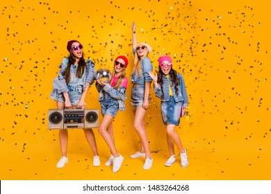 Full Length Body Size Photo Of Group Of Four Excited Positive Cheerful Careless Trendy Student Teen Ladies Mom Daughters Celebrating Luck Isolated Yellow Background