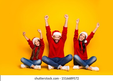 Full Length Body Size Photo Of Cheerful Excited Cute Nice Family Excited Crazy With Winter Holiday Started Wearing Jeans Denim  Red Sweater Overjoyed Sitting On Floor Isolated Over Color Background