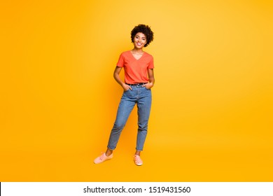 Full Length Body Size Photo Of Cool Swag Good Black Millennial Girl Posing In Front Of Camera Showing Her Coolness Wearing Jeans Denim Sneakers Isolated Over Vibrant Color Background