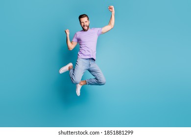 Full length body size photo of jumping up happy smiling bearded fan yelling isolated on vivid blue color background - Shutterstock ID 1851881299