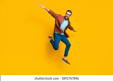 Full length body size photo of male student playful cheerful student laughing isolated on bright yellow color background - Shutterstock ID 1892767846