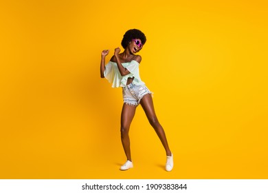 Full Length Body Size Photo Of Black Skinned Girl Wearing Stylish Summer Clothes Dancing On Dance Floor Isolated On Bright Yellow Color Background