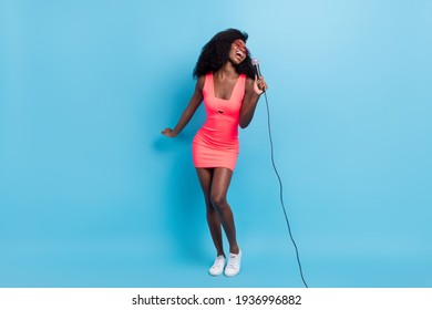 Full Length Body Size Photo Of Woman Keeping Microphone Singing Isolated On Bright Blue Color Background