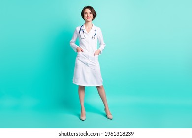 Full Length Body Size Photo Of Nurse Smiling Wearing White Coat Glasses Isolated On Vivid Turquoise Color Background