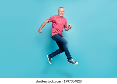 Full length body size photo smiling man jumping running fast on sale isolated pastel blue color background
