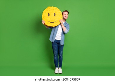 Full Length Body Size Photo Of Man Keeping Smile Icon Yellow Happy Face Isolated Bright Green Color Background