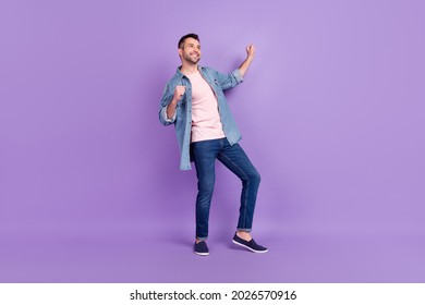 Full length body size photo man smiling dancing at party dreamy looking copyspace isolated pastel violet color background - Shutterstock ID 2026570916