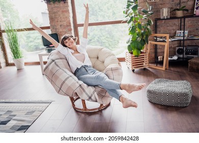 Full length body size photo woman sitting careless in armchair smiling relaxing on holiday