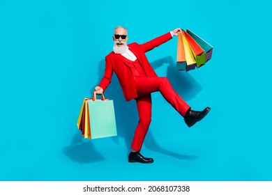Full length body size photo aged man keeping bags shopping mall happy careless isolated vivid blue color background