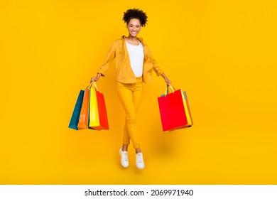 Full Length Body Size Photo Woman Jumping With Bag In Shopping Center Isolated Vibrant Yellow Color Background