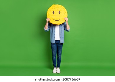 Full Length Body Size Photo Of Man Keeping Smile Icon Hiding Face Isolated Bright Green Color Background