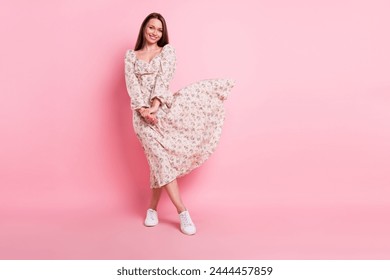 Full length body size photo pretty girl in floral dress smiling isolated pastel pink color background blank space - Powered by Shutterstock