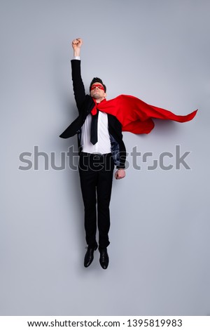 Full length body size photo jumping high he his him I save world expression costume flight up fist raised superman pose mood wear formal wear white shirt suit jacket tie isolated grey background
