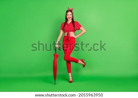 Full length body size photo woman in red outfit keeping parasole before rain isolated vivid green color background