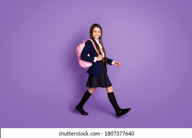 Full length body size profile side view of her she attractive cheerful small little schoolchild going back to school new season semester isolated violet lilac purple pastel color background - Shutterstock ID 1807377640