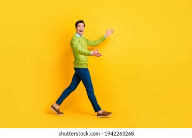Full Length Body Size Profile Side View Of Attractive Cheerful Guy Walking Meeting Invisible Friend Partner Isolated On Vivid Yellow Color Background