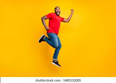 Full Length Body Size Side Profile Photo Of Casual Winning Rejoicing Overjoyed Running Black Man Isolated With Yellow Background