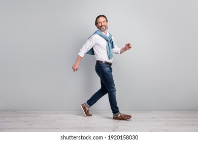 Full Length Body Size Side Profile Photo Of Man Wearing White Shirt Jeans Walking In Meeting Isolated On Pastel Grey Color Background