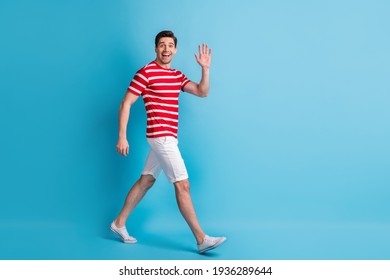 Full Length Body Size Side Profile Photo Man Walking Waving Hand Meeting Isolated On Bright Blue Color Background