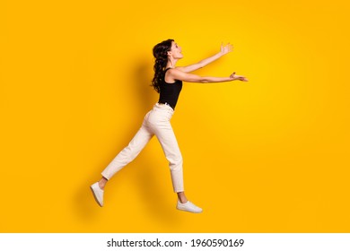 Full Length Body Size Side Profile Photo Of Woman Jumping Up Opened Hands Missing Someone Isolated Vivid Yellow Color Background